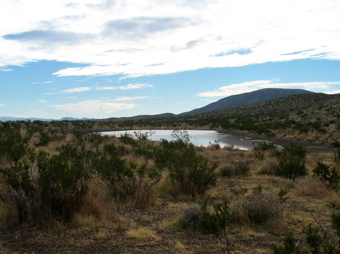 Even the clouds building in the sky couldn't dampen our enthusiasm as we hike over a ridge to find that even tiny Burro Lake is brimming with water.