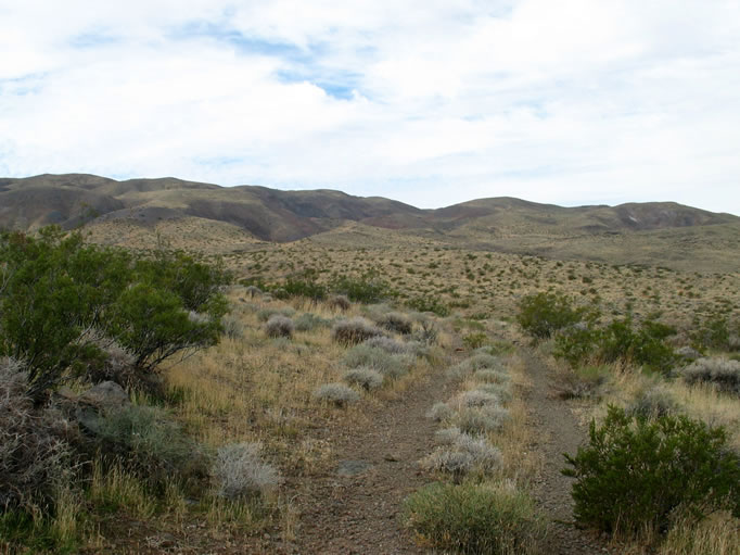 Leaving the lake, we pick up a portion of a two track before it, too, eventually disappears in a wash.