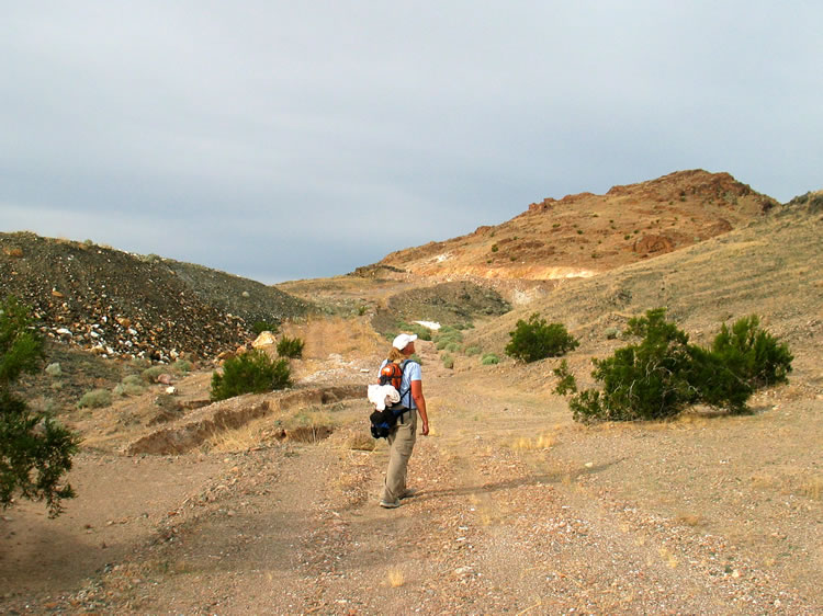 We approach the tailings from the mine.  Jamie checks out that UFO.