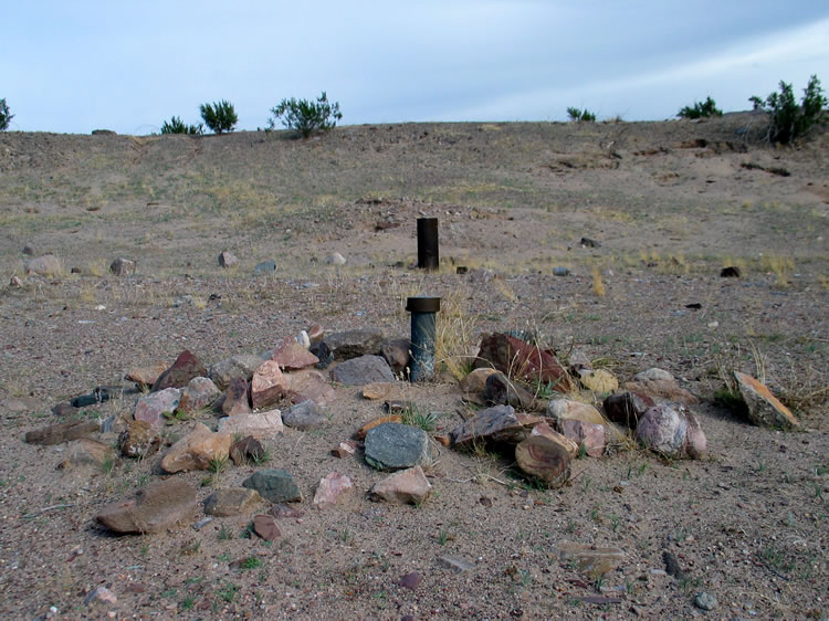 Just behind the 1940 benchmark in the foreground is an old well casing.  It's now filled with rocks.