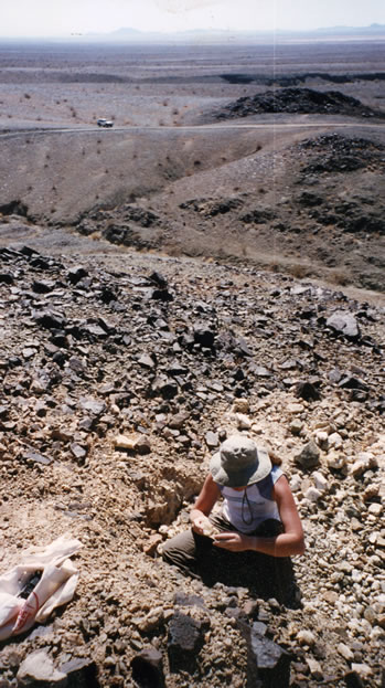 On the hillside adjacent to the mine Niki works a quartz vein and finds a pocket of crystals.