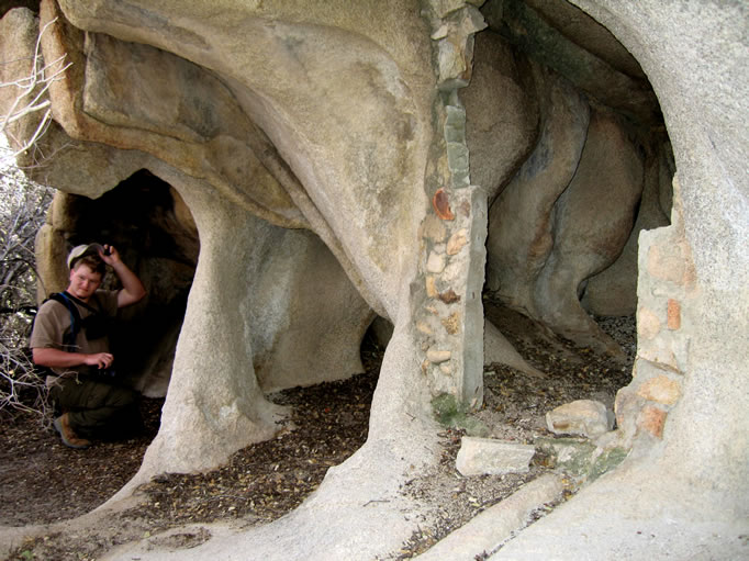 The partially walled cove to the right probably served as a cold storage vault and would have had a door.  Dezdan scratches his head as he tries to decipher the pictograph.