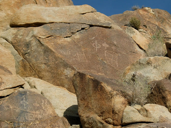 Note the digitate anthropomorph, or human figure representation with fingers or toes, in the lower left corner of the photo.