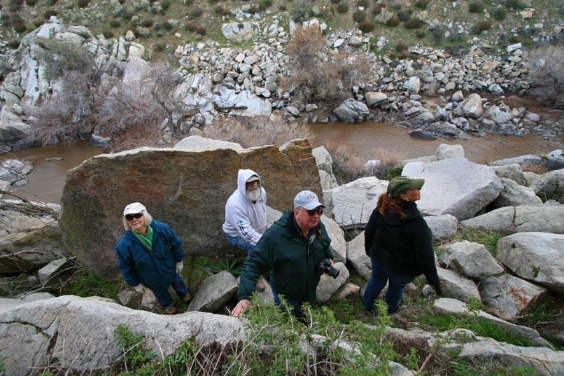 About halfway down to the river, we climb sideways along the steep slope a bit and arrive at our destination.  Above us, Jack Sprague, our trip leader, prepares to give us some information about the site.