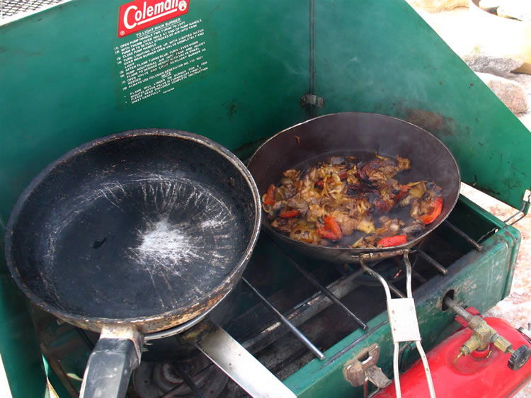 The secret to his success lies with the particularly high quality cookware that he uses.  Heheheh.   We accuse him of using illegal ingredients scraped off of Kelbaker Road yesterday afternoon.
