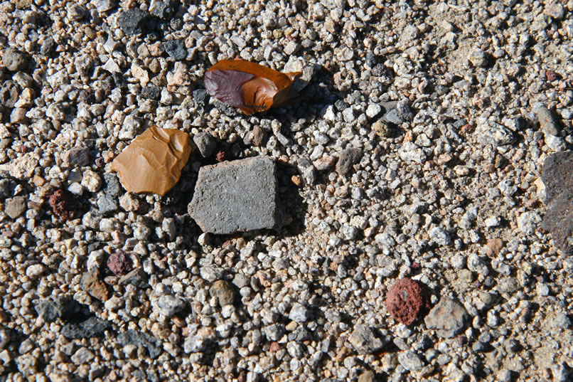 Here are a couple more worked jasper flakes and a piece of pottery.