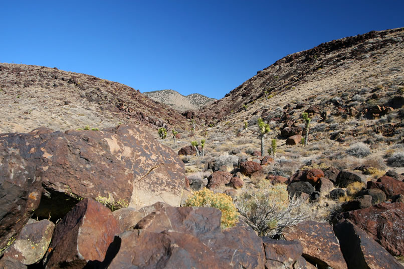 We can't wait to finish up with the boulders on this little ridge because the wide spot in the wash ahead looks interesting.