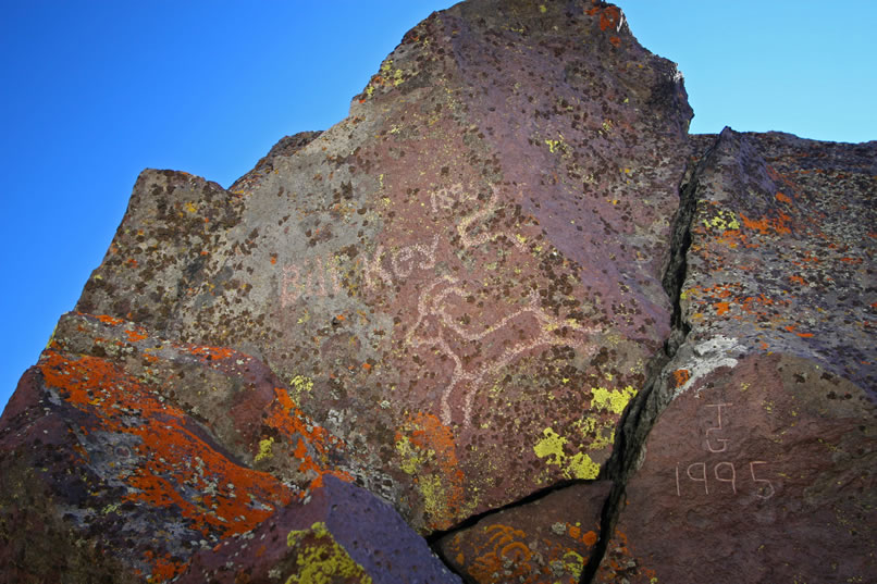 High on the rim of this little bowl, and easy to miss, is a very interesting historic inscription.  It reads, "Bill Key  1895," and is embellished with a running bighorn glyph.  Bill Key was involved with Death Valley Scotty during his stay in Death Valley and consequently had a "colorful" career in these parts before heading south to what is now Joshua Tree National Park to establish himself as a prominent rancher and miner.