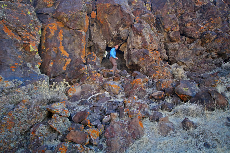 Still, we do find some interesting things.  Niki comes upon a shallow cave with the remains of a low rock wall in front of it.  This might have been used as a hunting blind or for ceremonial purposes.