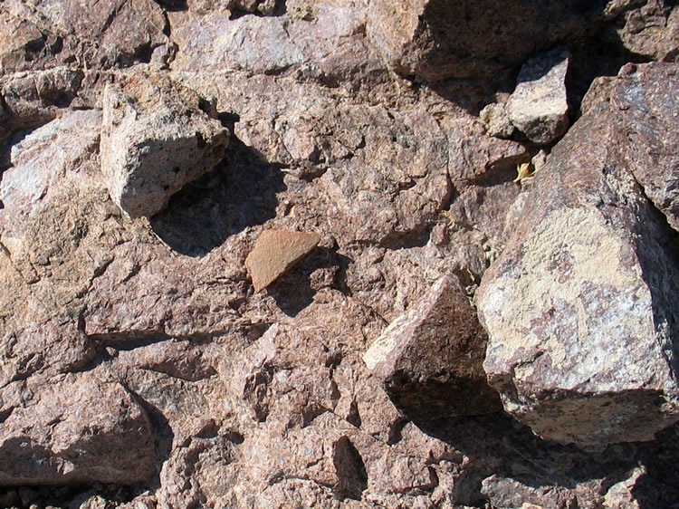 While climbing back down Niki finds another pottery fragment.