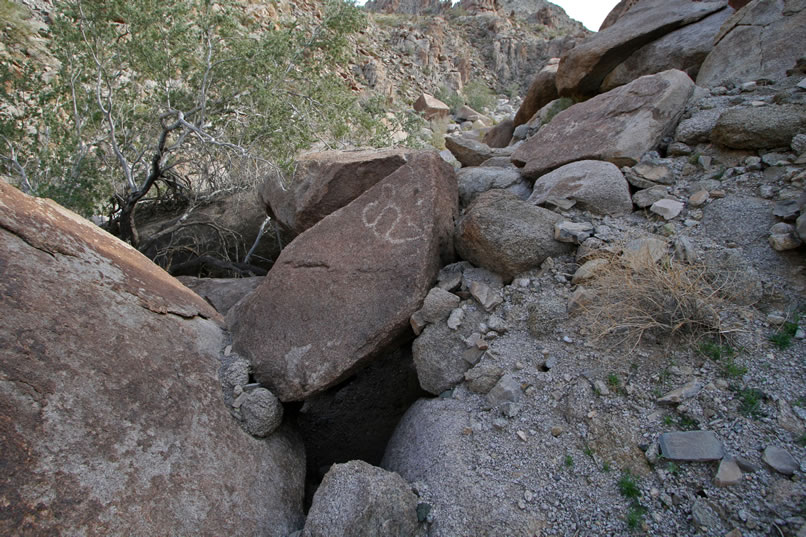 Jamie finds that there are some nice petro boulders up on the hillside above the wash.