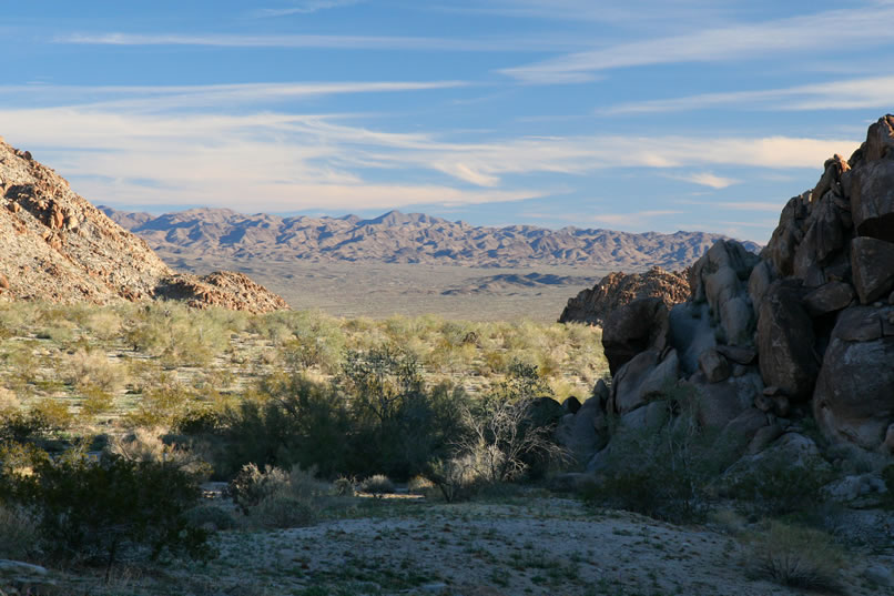 The scenery from here is pretty spectacular.  Here's a telephoto view out past the dark edge of the hill to the valley beyond.