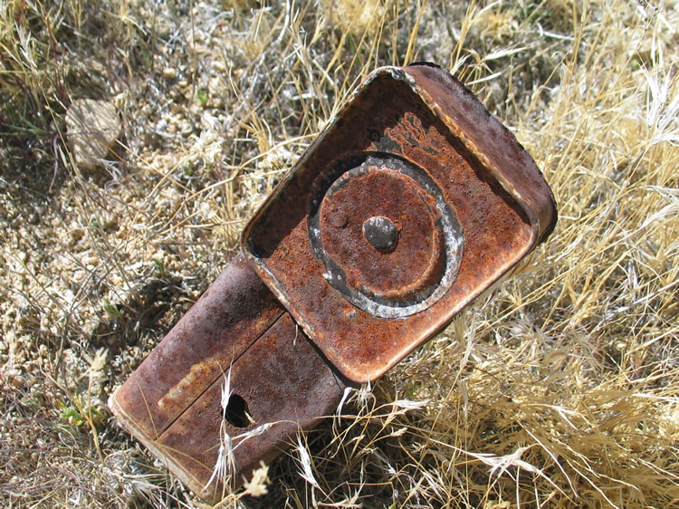 I find a trash scatter of old hole and cap cans.  This would indicate dates from the late 1880's to early 1900's.