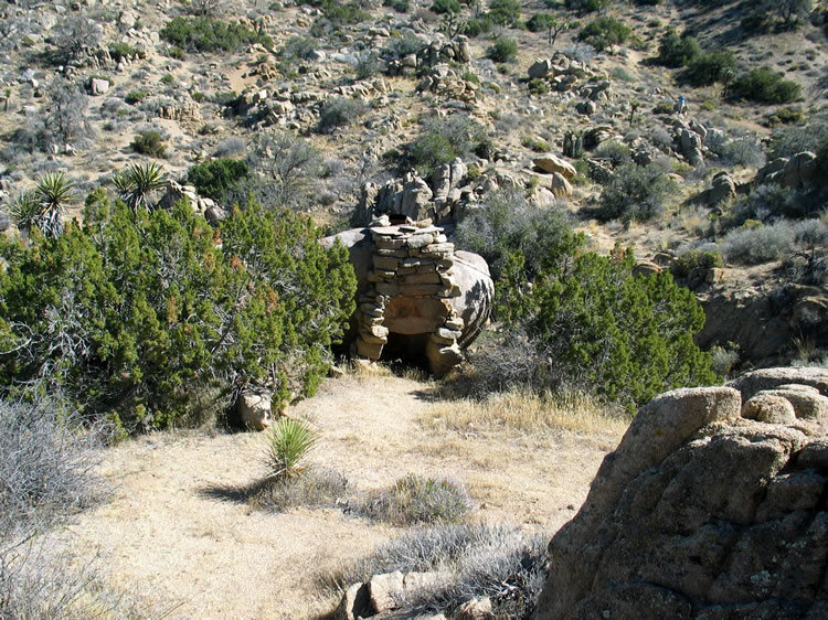 It's a fireplace!  The level spot in front would hint that a structure or tent might have been built here.