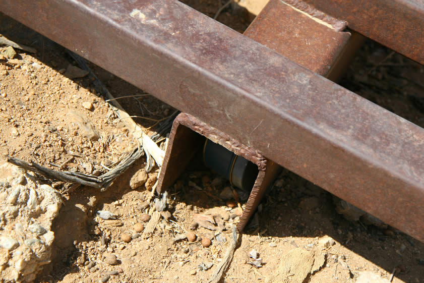 In this case, the cattle guard makes a perfect hiding spot for the Under the Boardwalk geocache.  You can just see it tucked into the metal frame of the cattle guard.