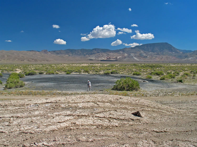This site was first claimed by Mott and Piper in 1873, but the claim was soon bought out by Pacific Borax.  Jamie is prowling the area east of the mill where the old Chinese Camp once stood.