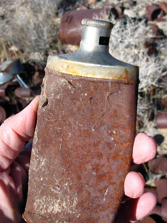 Another Dr. Lyon's tooth powder tin.  This one has the cap raised to the open position from which the powder could be tapped out.