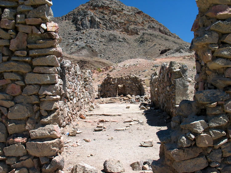 This view looks eastward toward the large stone fireplace.