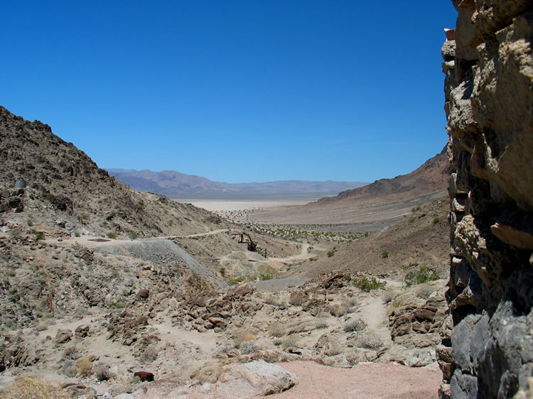 A view of the mill foundation on the side of the wash with the Amargosa River sink in the background.