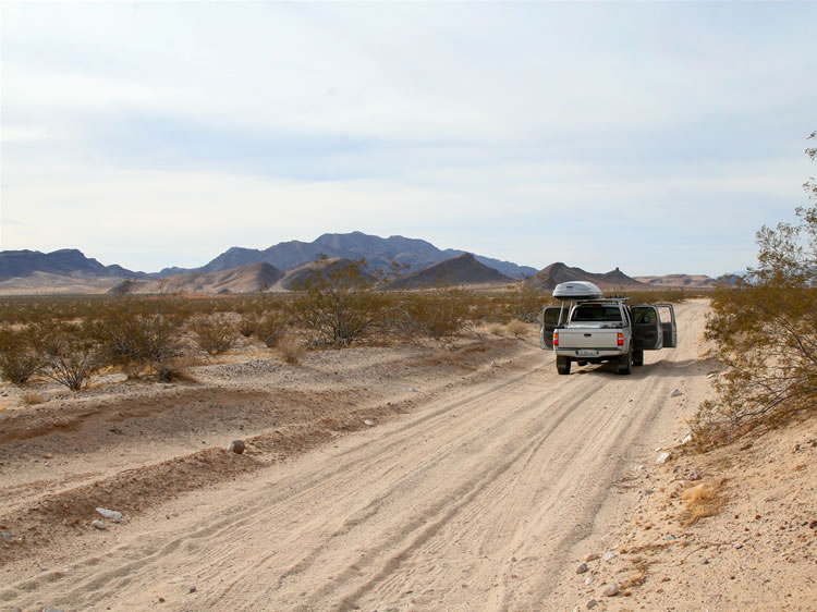 A view of the Ship Mountains from the railroad access road.  We've stopped here to photograph a tarantula crossing the road.  Ahead are the low hills where the opalite deposit is located.