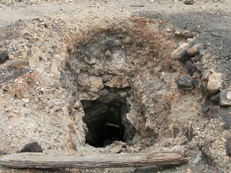 Nearby is a deep shaft whose entrance is choked with a large piece of machinery.
