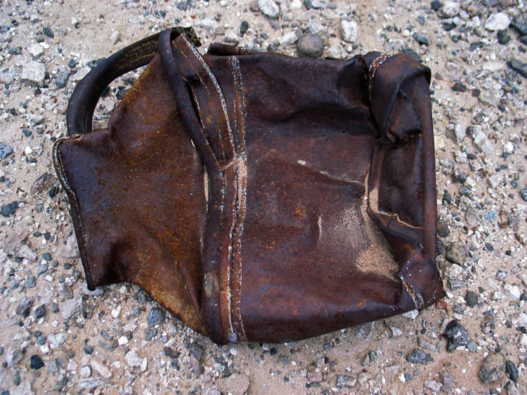 We're losing our daylight now and our cameras struggle to photograph this heavy container that appears to be a large flattened pitcher with soldered seams.  Once back in the truck we scurry off to our selected campsite near an old ruin and mine.  We make our final approach using the headlights.