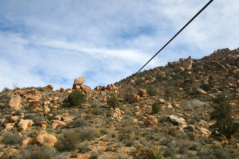 The cable runs up to a shelf road which connects to the main workings off to the right and then it angles steeply upward again to a couple of prospects further up the mountain.