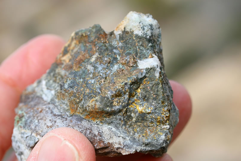 While Jamie gets out her macro lens and takes a few photos of some of the rocks from the tailings pile, Niki climbs further up the mountainside to check out two more prospects.