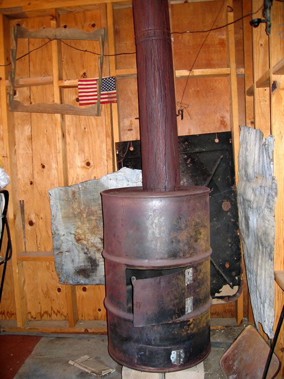 A robust stove in the corner of the living room.