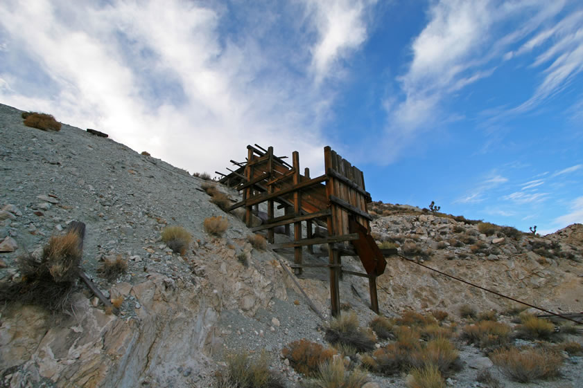 Niki decides to climb up to the saddle above the mine while Jamie explores the main level and finds a small ore bin.