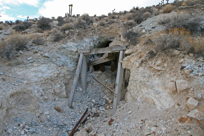 Other adits and shafts in this area are badly caved in and impassable.