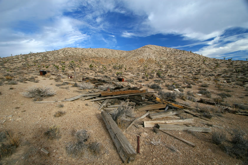 Exploring further uphill from the metal cabin turns up a sizeable ruin as well as lots of interesting trash.