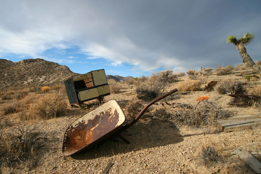 A closer look at the wheelbarrow and stove.