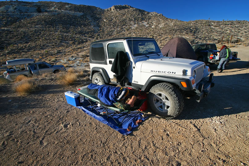 Due to the below freezing temperatures last night, we expect to find that Dezdan has turned into a popsicle inside his sleeping bag.  However, even though it takes him a little longer to make an appearance, he's survived!  Those Jeep owners are a tough breed!