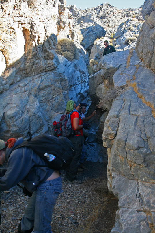 Instead of scrambling up the chute as Dan did, we all decide to ascend via the ledge that you can see along the right of the photo.