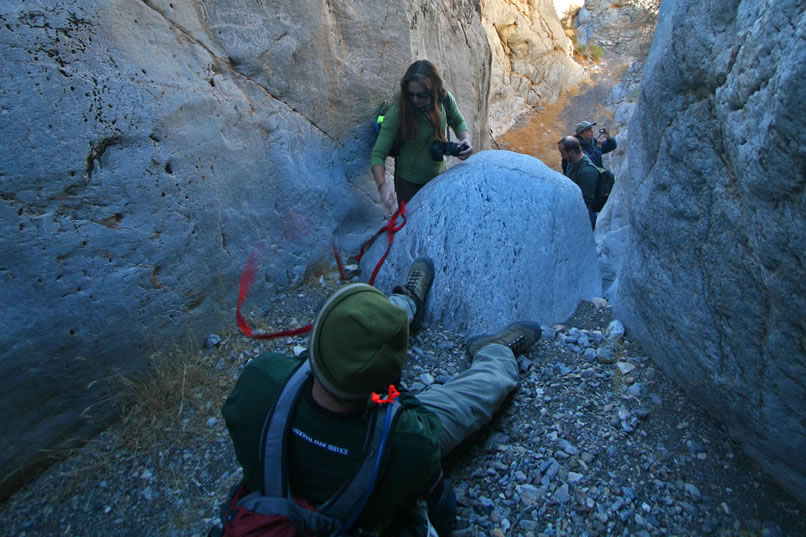 Niki arrives at the top of the chock stone.
