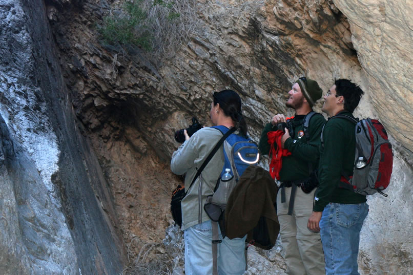 Well, the next thing turns out to be the longest and steepest chute yet!  Here Alysia, Guy and Dezdan watch Micah earn his keep by donning his climbing shoes and free climbing the obstacle.