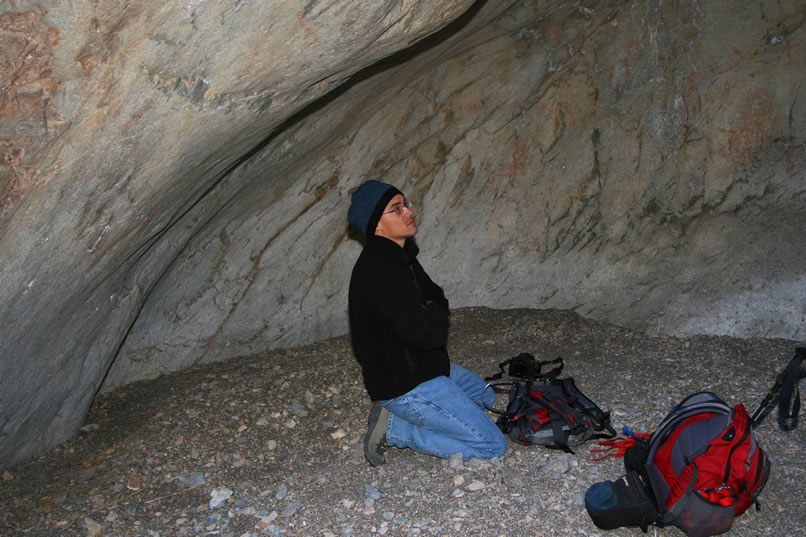 Guy soaks up the ambience and tries to stay warm until it's time to climb again.