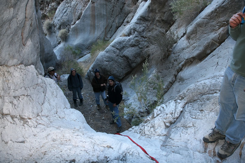 But, just as we found in the lower canyon, after a short stretch of easy going there's always another obstacle.  This one isn't that bad and a bit of webbing is enough to enable everyone to scramble up.